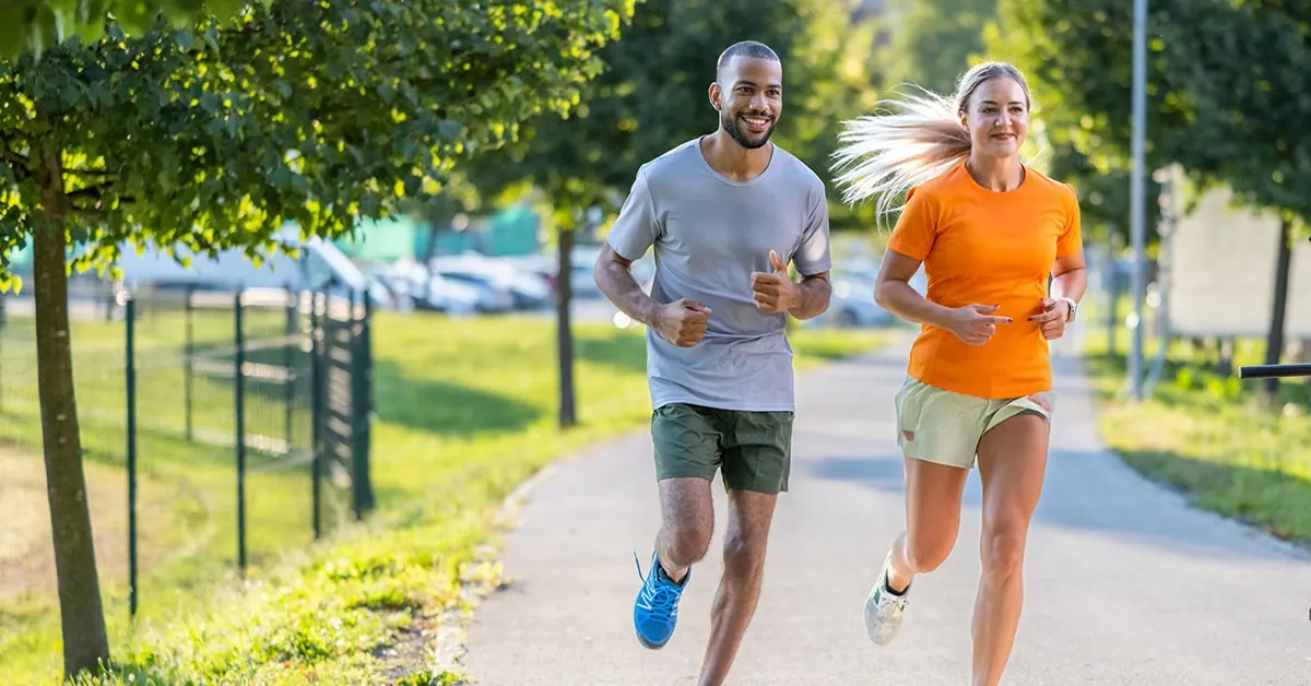 Man and woman running in the park