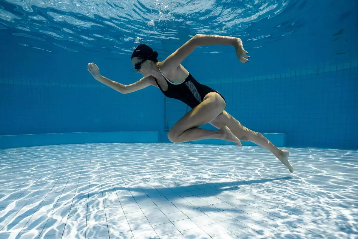 Woman running in the pool