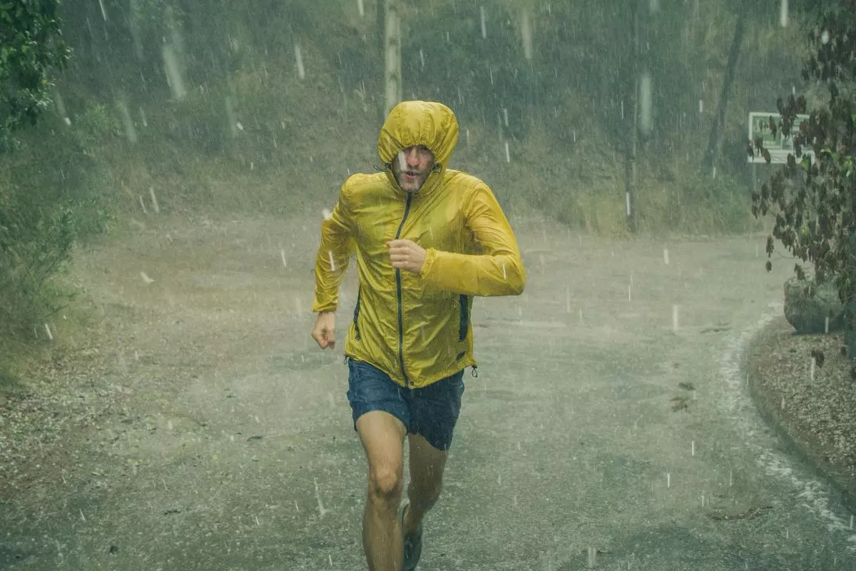 Men wearing a waterproof or water-repellent jacket for running in the rain