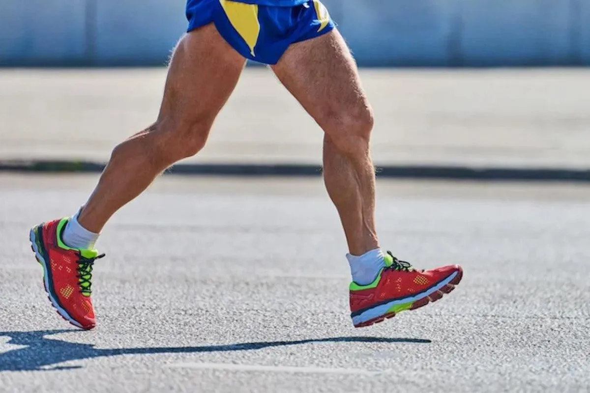Runner foot heel striking the ground forcefully while run