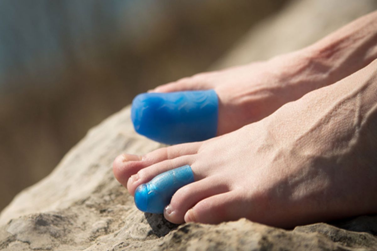 Runner using silicone or gel toe caps for protecting toenails