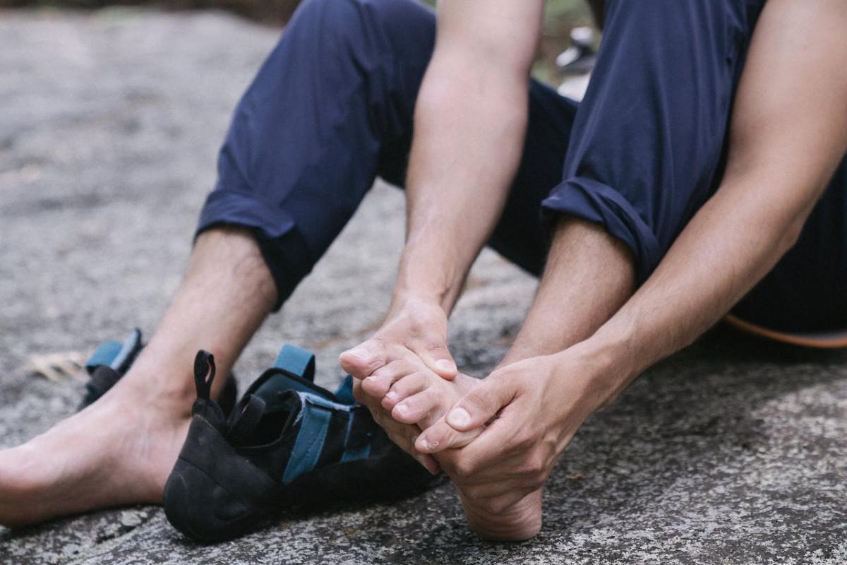 A man is in pain associated with bunions after running