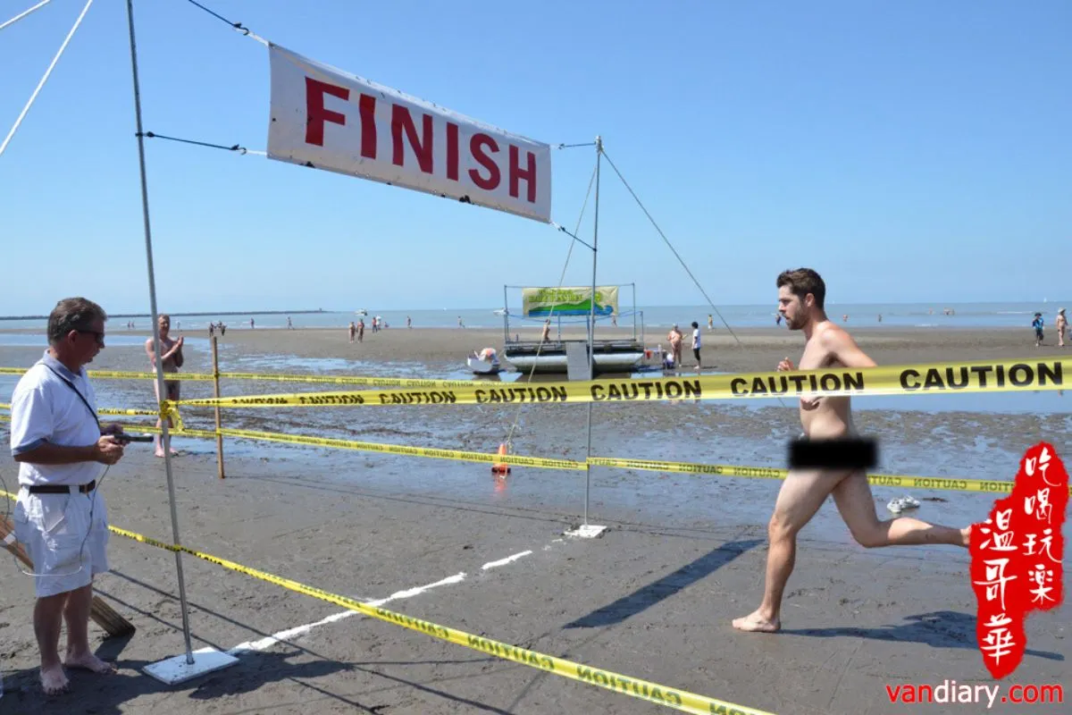 Man running to a finish in a 5k naked race