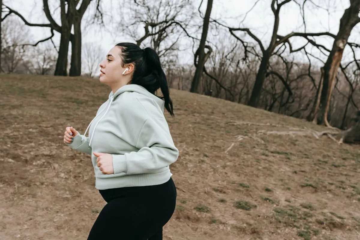 Woman running daily for weight management and calorie burning