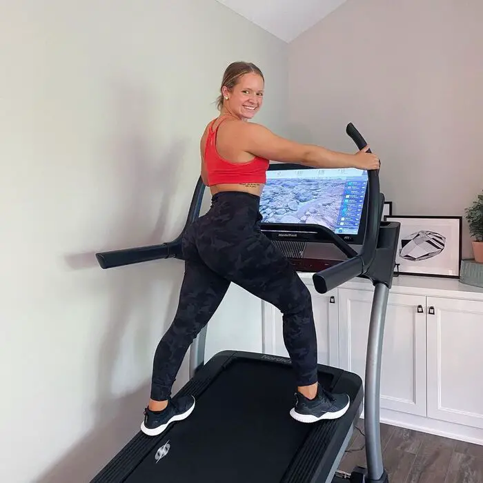 Woman exercising on a Nordictrack X32i treadmill