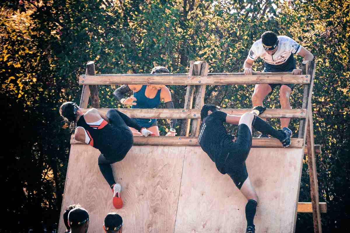 People conquering obstacles in a race