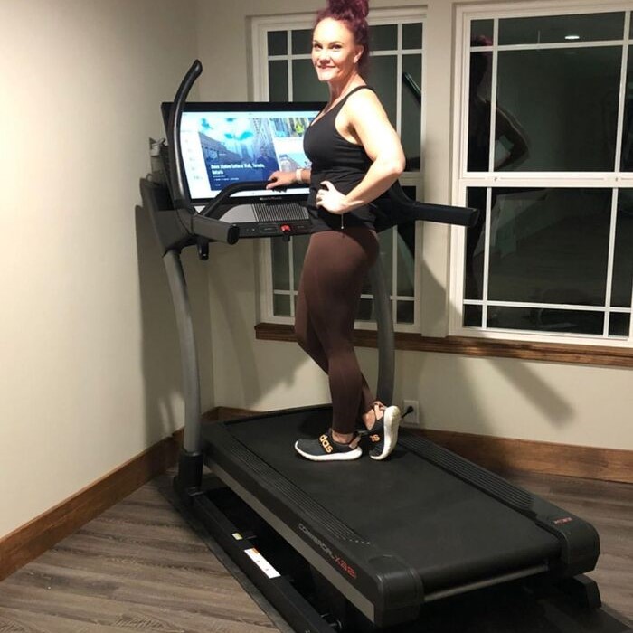 Woman exercising on a NordicTrack  treadmill