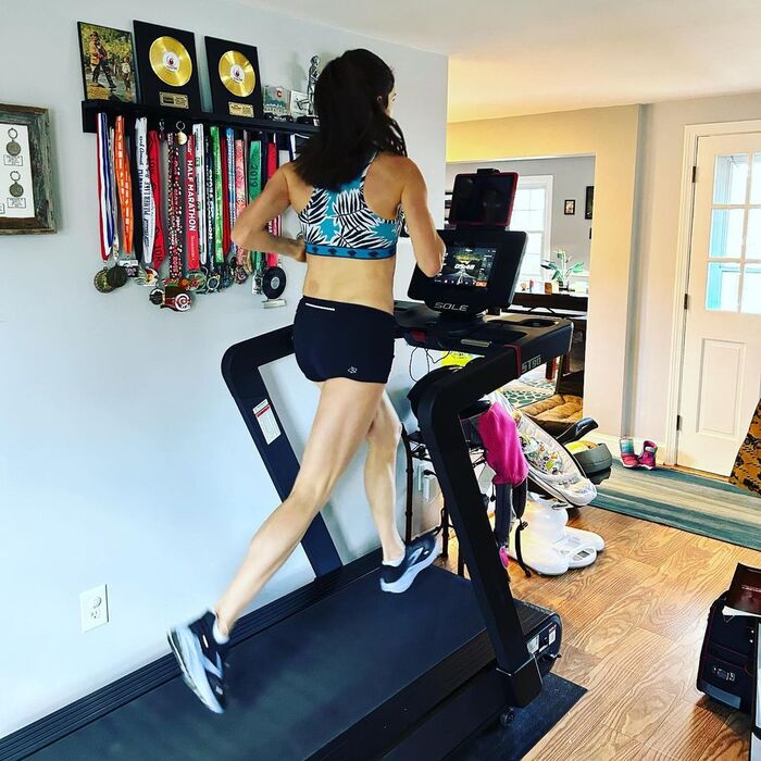 Woman running on a Sole ST90 treadmill